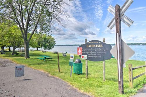 a sign at a park next to a body of water at Lakefront Cayuga Retreat with Private Deck and Hot Tub in Cayuga