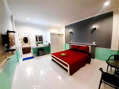 Fancy Carp Resort Hua-Hin tesisinde bir odada yatak veya yataklar