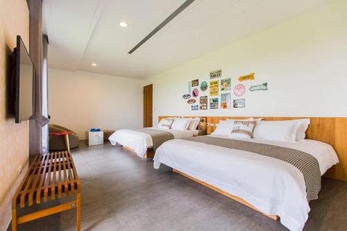Ein Bett oder Betten in einem Zimmer der Unterkunft Qi Li Xiang Homestay