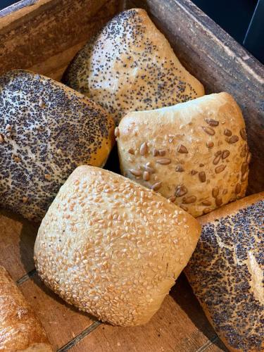 a box filled with different types of bread at Parkhotel Villa des Effats Vielsalm in Vielsalm
