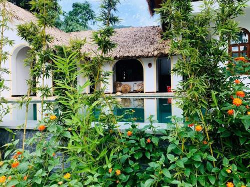 an exterior view of a house with a pool at Mai Chau Rustic Home in Mai Chau