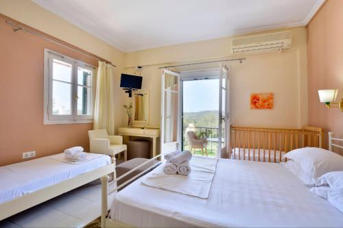 A bed or beds in a room at Xristina