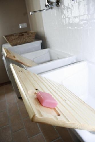 a pink item sitting on top of a counter in a bathroom at Particolari del Brenta in Oriago Di Mira