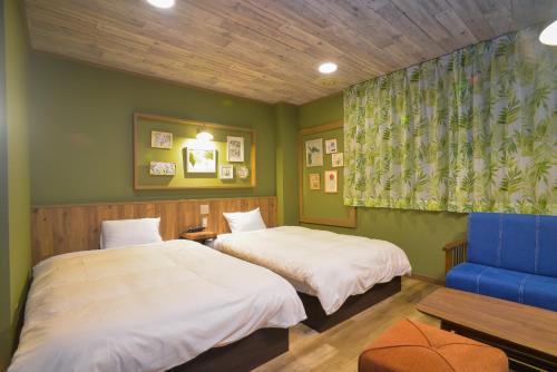 Кровать или кровати в номере 下呂スプリングスホテル