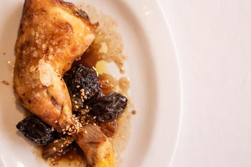 a plate of food with a piece of food with fruit at Hostal Crisami in Solsona