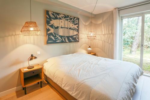 Uma cama ou camas num quarto em Villa Pinkmary Pour 10 Personnes