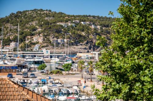 a marina with a bunch of boats in it at Seafront Apartment in Port Sóller in Port de Soller