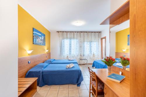 Postel nebo postele na pokoji v ubytování Laguna B&B