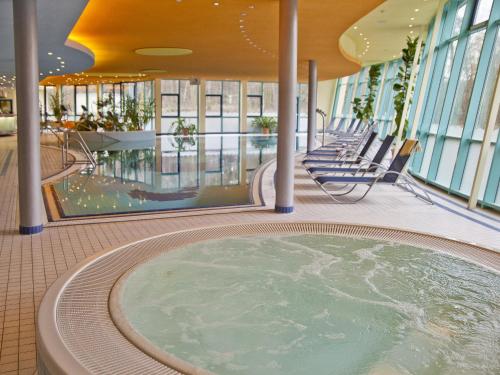 a hot tub in the middle of a building at Hotel Seehof Haltern am See in Haltern
