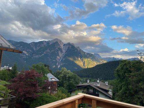 a view of a mountain range from a house at Casa Belvedere in Pieve di Cadore