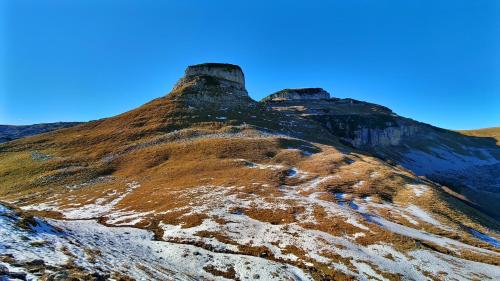 a mountain with snow on the side of it at Berglebnis in Tauplitz