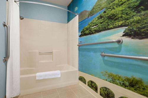 A bathroom at Super 8 by Wyndham Lindsay Olive Tree