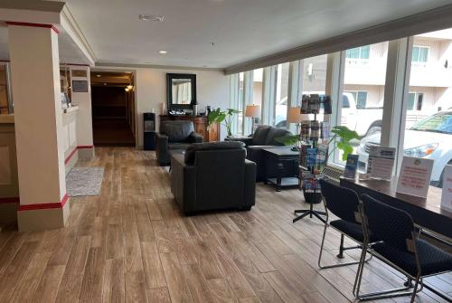 a lobby with couches and chairs in a store at Ramada by Wyndham Juneau in Juneau