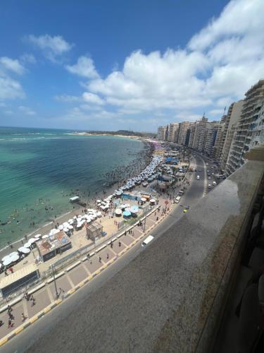 a view of a beach with buildings and the ocean at شقق بانوراما شاطئ الأسكندرية كود 4 in Alexandria
