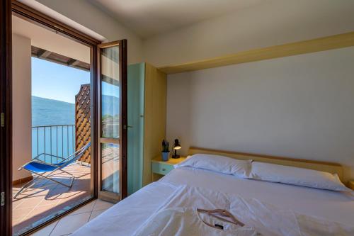 Postel nebo postele na pokoji v ubytování Residence Ruculì - Ruculì Hospitality