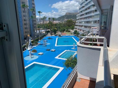 a view of a swimming pool from the balcony of a building at SERVICE APART LAZARO - Apartamentos Aguamarina 43-C in Calpe