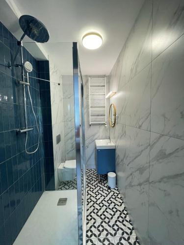 Kúpeľňa v ubytovaní Dubois Apartments Kołobrzeg
