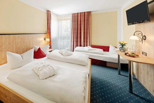 Ένα ή περισσότερα κρεβάτια σε δωμάτιο στο Hotel Park Cafe Reichl