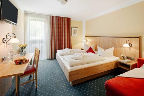 Ein Bett oder Betten in einem Zimmer der Unterkunft Hotel Park Cafe Reichl