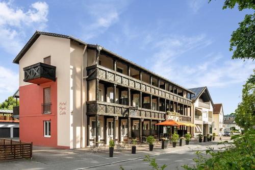 a building on a street in a town at Hotel Park Cafe Reichl in Bad Abbach