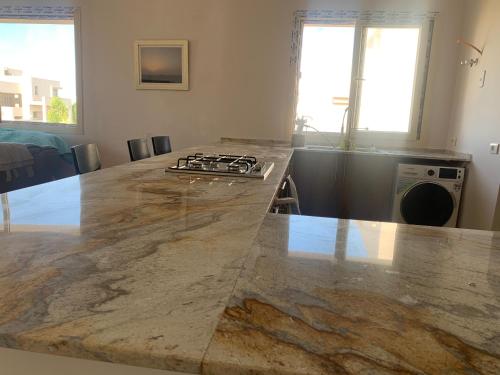 A kitchen or kitchenette at Hacienda bay painthouse 4 bathrooms