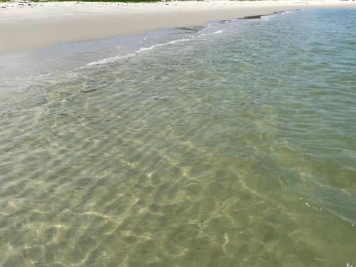 a beach with the sand and the water at My Beach Villa in Port Dickson