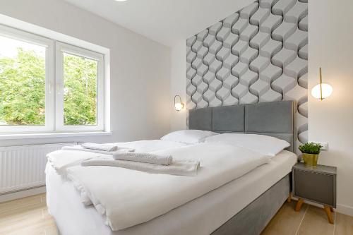 Posteľ alebo postele v izbe v ubytovaní VacationClub – Prusa 2 Apartament 3B