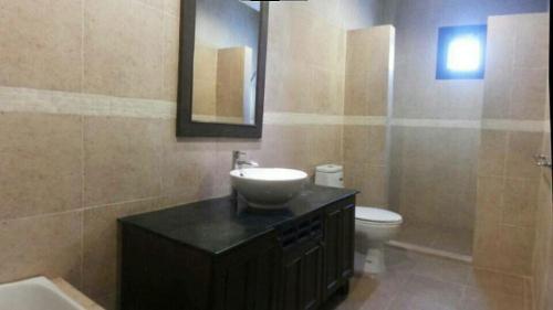 a bathroom with a sink and a toilet at Sunflower Villas in Ko Chang