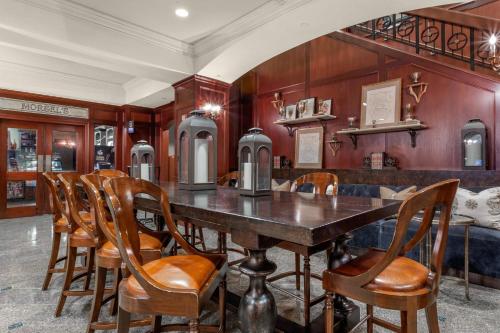 a dining room with a table and chairs at Omni New Haven Hotel at Yale in New Haven