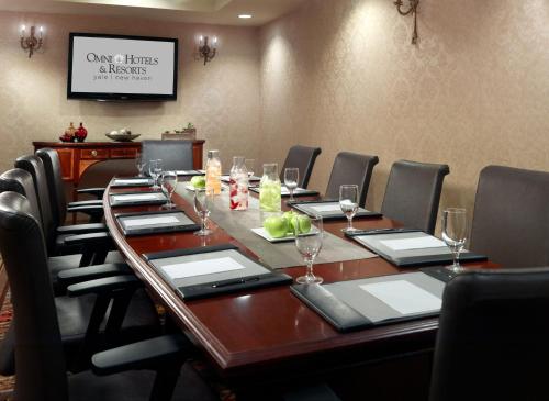 a conference room with a long wooden table and chairs at Omni New Haven Hotel at Yale in New Haven