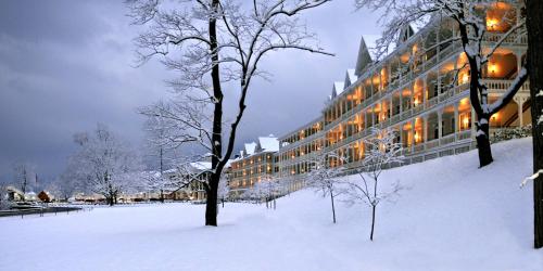 a building in the snow in a park at Omni Bedford Springs Resort & Spa in Bedford
