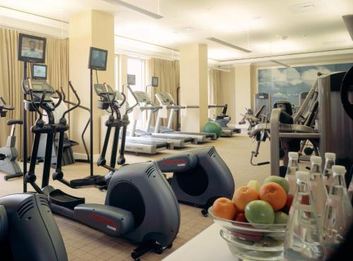 a gym with exercise equipment and a bowl of fruit at Mokara Hotel & Spa in San Antonio