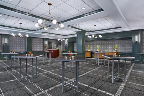 a rendering of a conference room with tables and chairs at Omni Interlocken Hotel in Broomfield