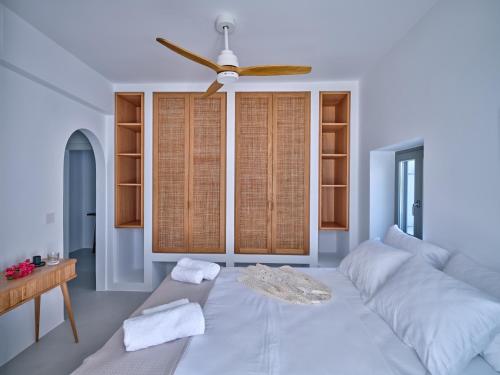 A bed or beds in a room at Siora of Paros - Ammiralis & Castelis