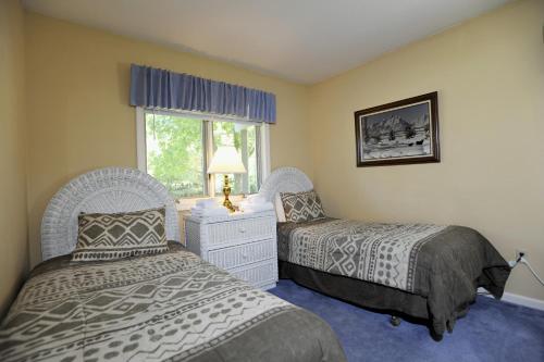 A bed or beds in a room at The Townhomes at Bretton Woods