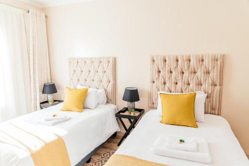 Ένα ή περισσότερα κρεβάτια σε δωμάτιο στο Esther Guest House
