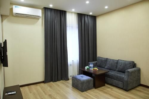a living room with a couch and a window at Residence North Avenue, Teryan 8 , apt14 3 in Yerevan