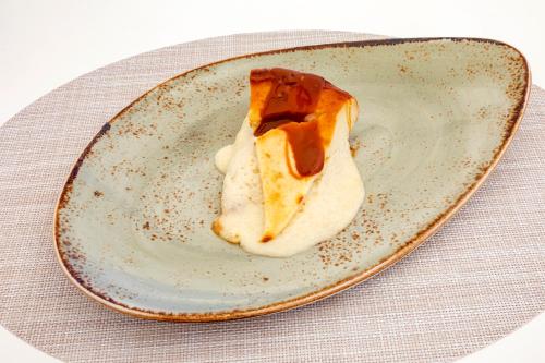 a piece of pie on a plate on a table at Hotel Maysi in Playa Migjorn