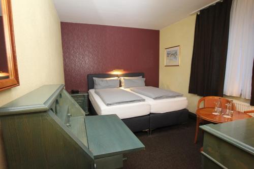 En eller flere senger på et rom på Hotel Restaurant zur Linde