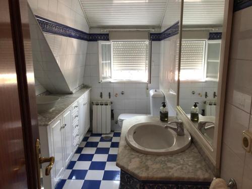 a bathroom with a sink and a toilet at Casa Santa Ana in Tourón