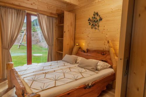 A bed or beds in a room at Lake Cottage - Koča ob jezeru