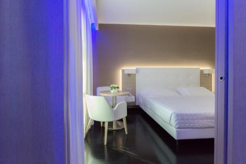 Postel nebo postele na pokoji v ubytování Raffaello Hotel & Mooka Restaurant