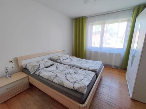 Tempat tidur dalam kamar di Ferienhaus Schwarzinger