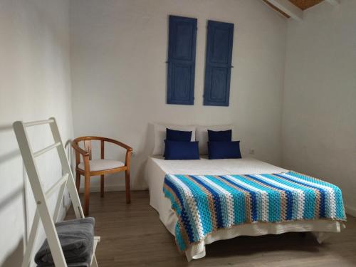 מיטה או מיטות בחדר ב-Monte da Rocha 3 Marias
