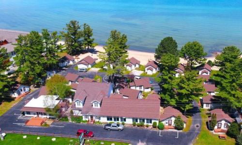 an aerial view of a house with the ocean at Beach House Lakeside Cottages in Mackinaw City