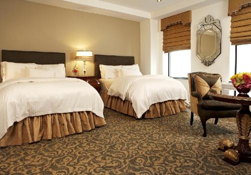 Кровать или кровати в номере The Kimberly Hotel