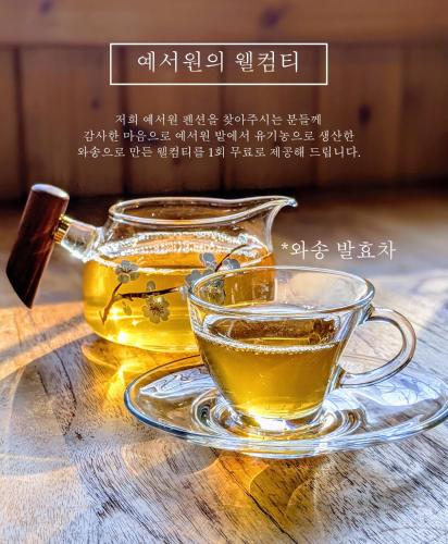 a glass cup of tea on a table at Healing Camp Yesone in Gangneung
