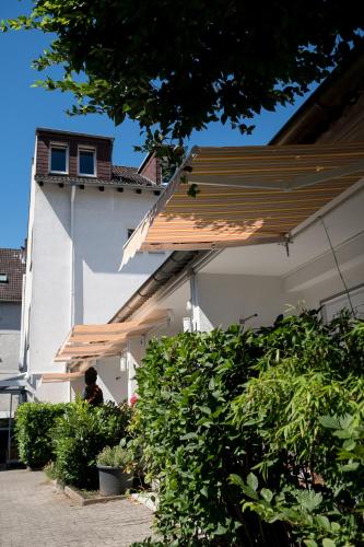a building with a wooden roof on top of it at Apartment in Innenstadtnähe in Darmstadt