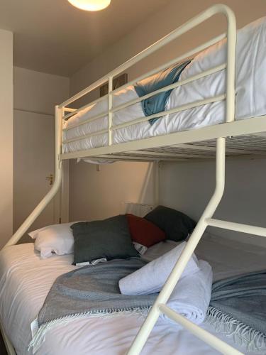 a bedroom with two bunk beds with towels at 14 Eyre Square Lane in Galway