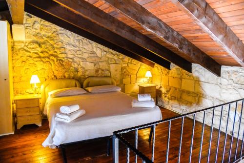 Posteľ alebo postele v izbe v ubytovaní B&B Demetra Appartamenti